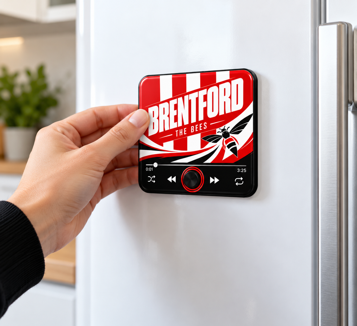Brentford The Bees sound magnet held by hand on fridge