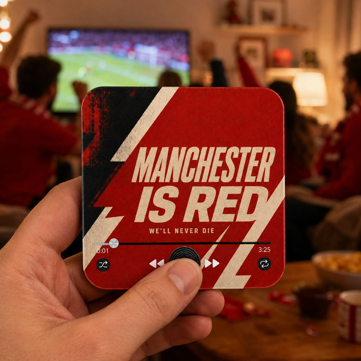 Manchester Red Football Sound Magnet held in hand during a football match at home